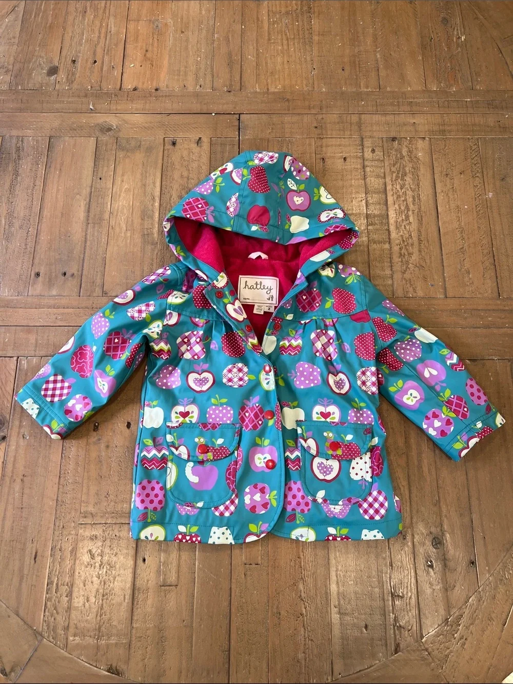 Hatley teal apple and worm print hooded raincoat girls 2T lined